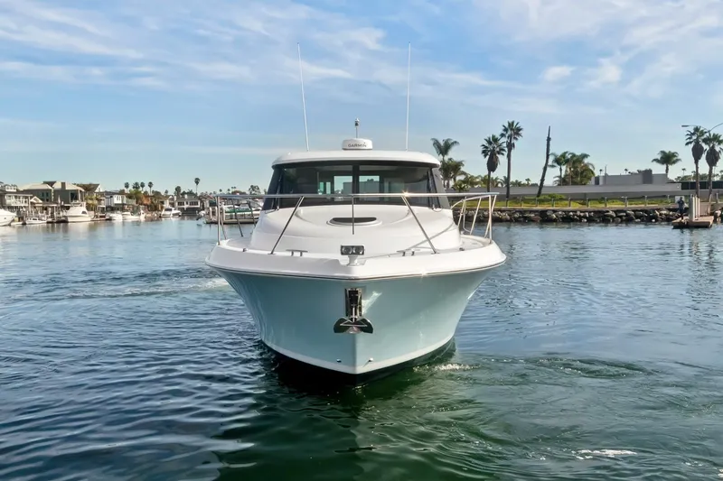 Slide: The Image of 2017 Tiara Yachts C39 Coupe cruising in a scenic marina setting. - 35