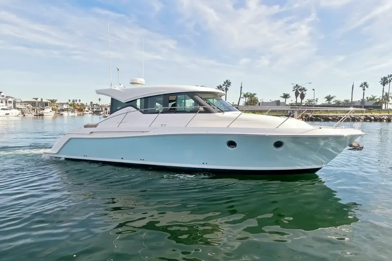 Slide: The Image of 2017 Tiara Yachts C39 Coupe cruising on calm waters under a clear sky. - 36