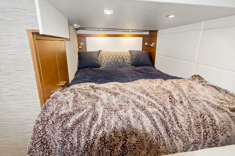 Slide: The Image of Cozy bedroom interior of 2017 Tiara Yachts C39 Coupe with plush bedding. - 7