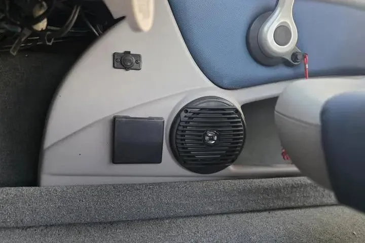 Slide: The Image of Interior of a 2017 Skeeter SL 190 boat showing speaker and control panel. - 18