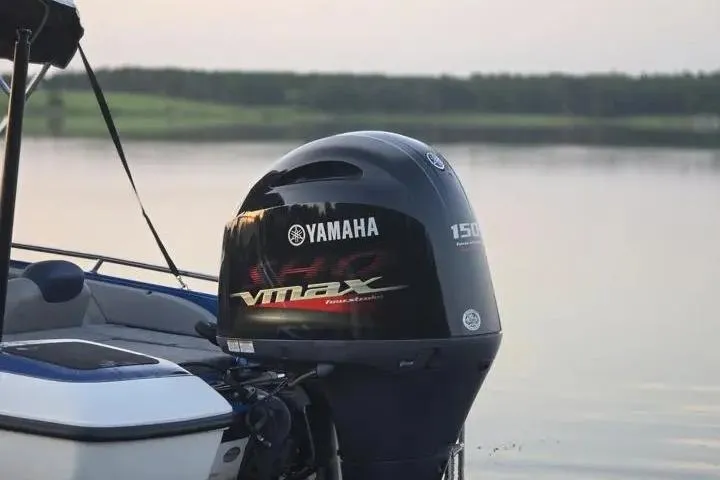 Slide: The Image of 2017 Skeeter SL 190 boat with Yamaha VMAX 150 outboard motor on a calm lake. - 3