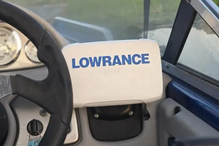 Slide: The Image of Steering wheel and Lowrance device in 2017 Skeeter SL 190 boat cockpit. - 32