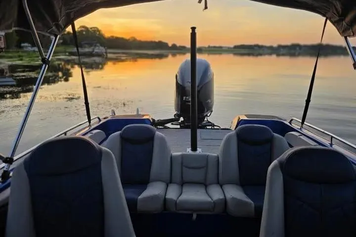 Slide: The Image of 2017 Skeeter SL 190 boat interior at sunset on a tranquil lake. - 7