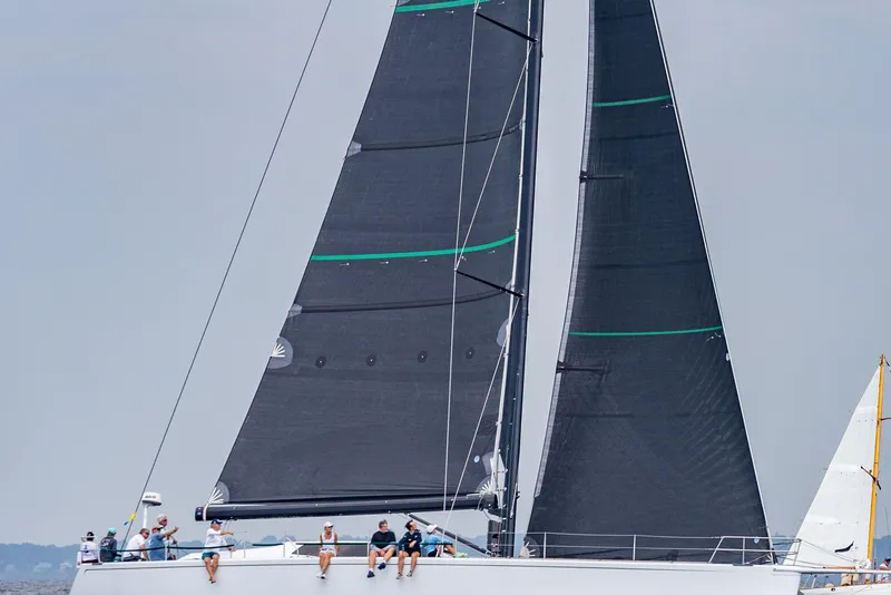 Slide: The Image of Sailing yacht with black sails, Reichel/Pugh 2007 model, crew on deck. - 22