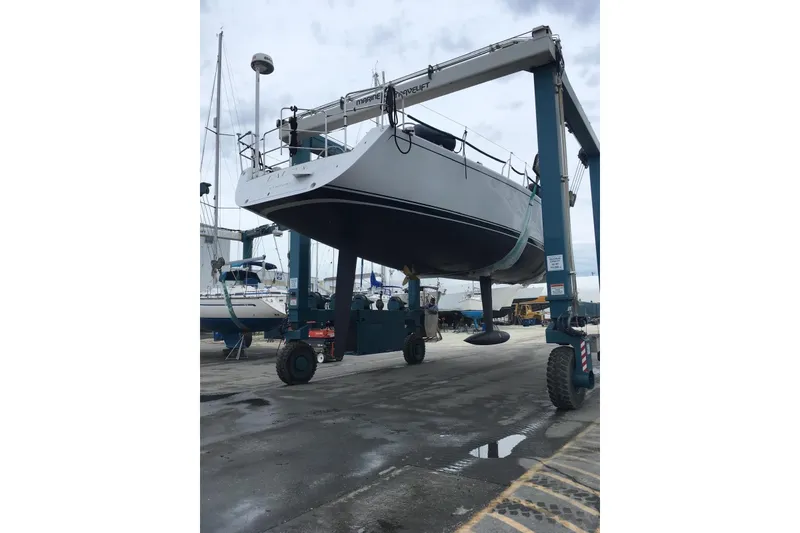 Slide: The Image of Reichel/Pugh 2007 yacht lifted by marine travel lift at a boatyard. - 28