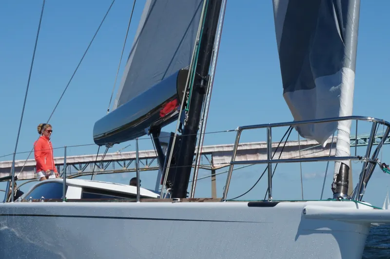 Slide: The Image of Reichel/Pugh 2007 sailboat with person on deck, blue sky. - 5