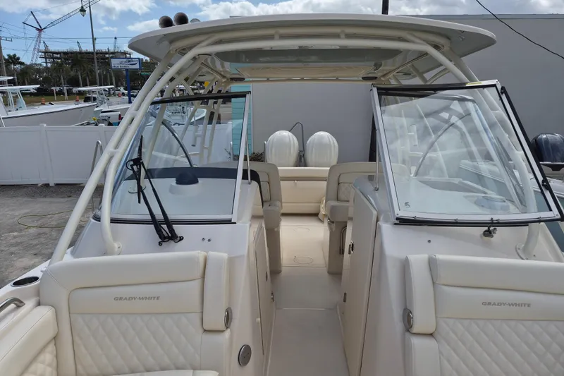 Slide: The Image of 2026 Grady-White Freedom 285 boat interior with dual consoles and seating. - 10