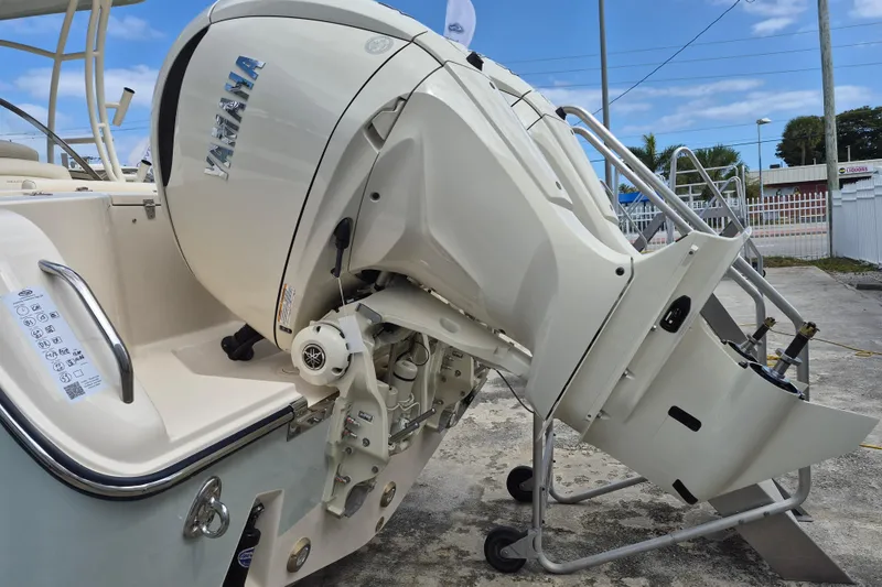 Slide: The Image of 2026 Grady-White Freedom 285 boat with Yamaha outboard motor, docked outdoors. - 23