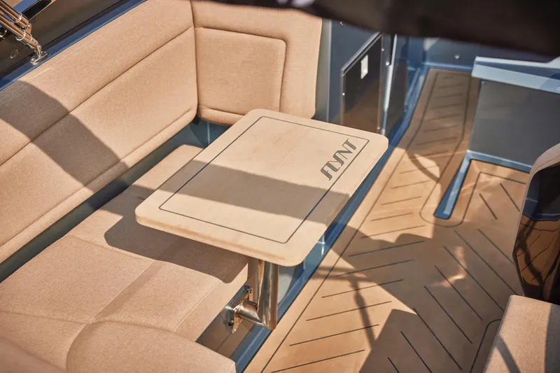 Slide: The Image of Luxurious interior of 2026 Flynt Yachts Speedera 26 OB with elegant seating and table. - 10
