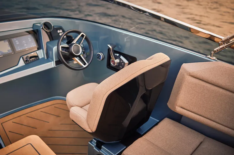 Slide: The Image of 2026 Flynt Yachts Speedera 26 OB interior with modern steering and seating. - 11