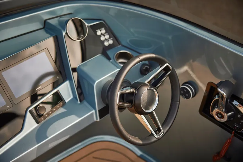 Slide: The Image of 2026 Flynt Yachts Speedera 26 OB dashboard with steering wheel and modern controls. - 12