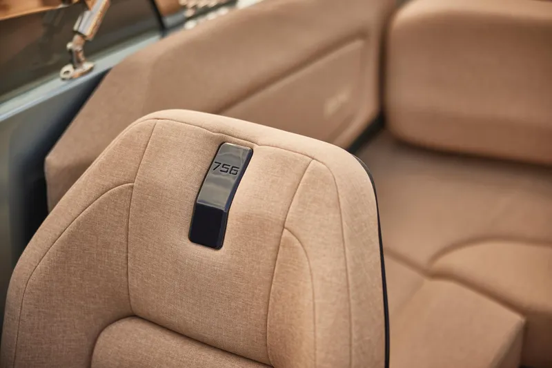 Slide: The Image of Luxurious interior of 2026 Flynt Yachts Speedera 26 OB with beige upholstery. - 13