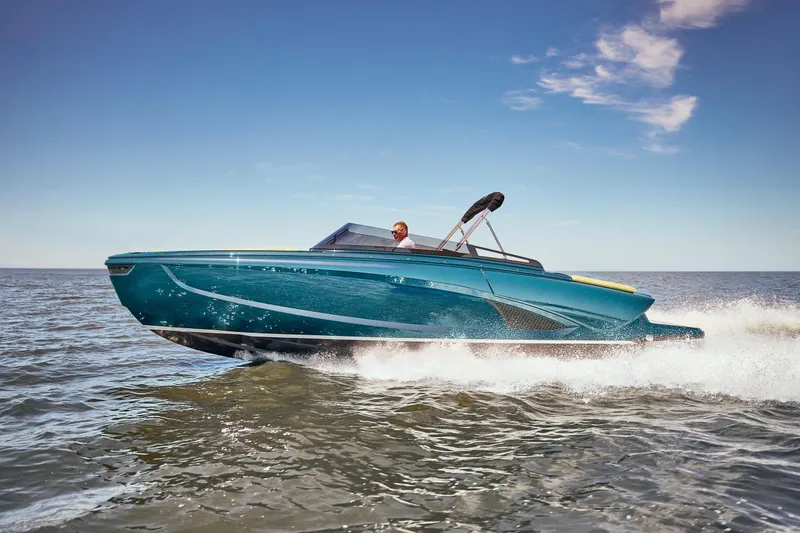 Slide: The Image of 2026 Flynt Yachts Speedera 26 OB cruising on open water under clear skies. - 16