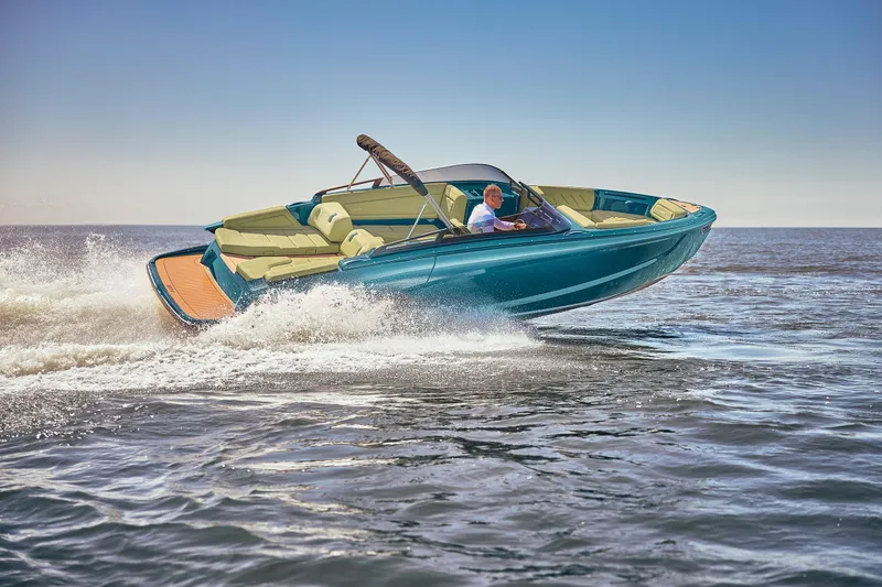 Slide: The Image of 2026 Flynt Yachts Speedera 26 OB cruising on open water, showcasing sleek design and performance. - 18