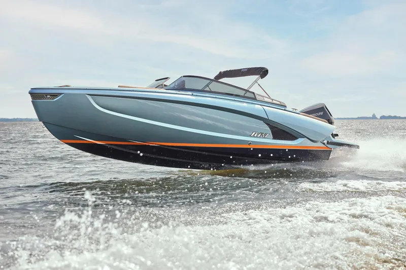 Slide: The Image of 2026 Flynt Yachts Speedera 26 OB cruising on open water. - 2
