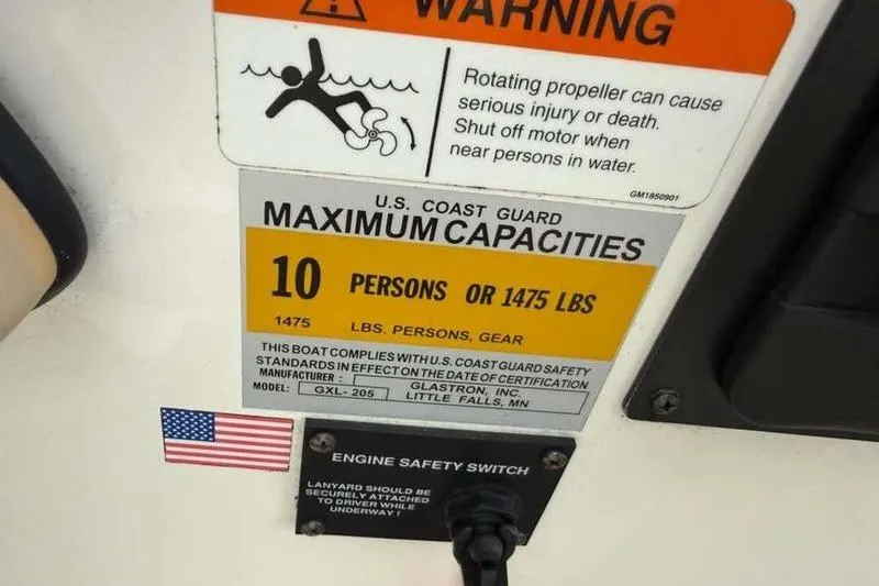 Slide: The Image of 2007 Glastron GXL 205 capacity warning label, 10 persons or 1475 lbs, safety instructions. - 14