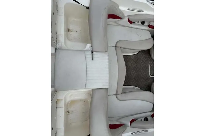 Slide: The Image of 2007 Glastron GXL 205 boat interior with white and red seating. - 8