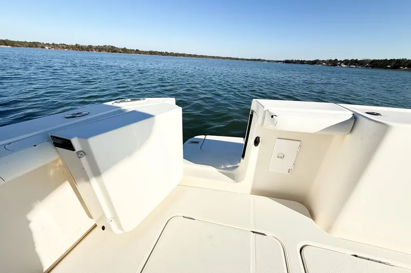 Slide: The Image of 2004 Silverton 48 Convertible boat deck overlooking calm blue waters. - 23