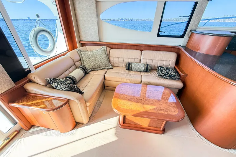 Slide: The Image of Luxurious interior of 2004 Silverton 48 Convertible yacht with plush seating and elegant decor. - 33