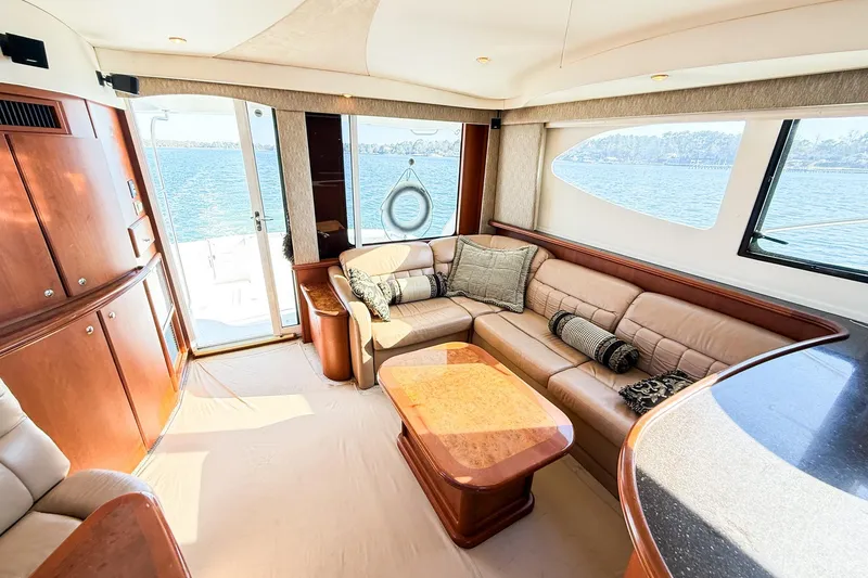 Slide: The Image of Luxurious interior of 2004 Silverton 48 Convertible yacht with leather seating and ocean view. - 35