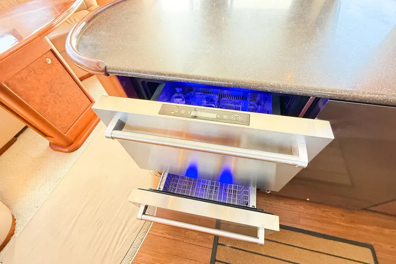 Slide: The Image of 2004 Silverton 48 Convertible yacht interior with open drawer refrigerator. - 46