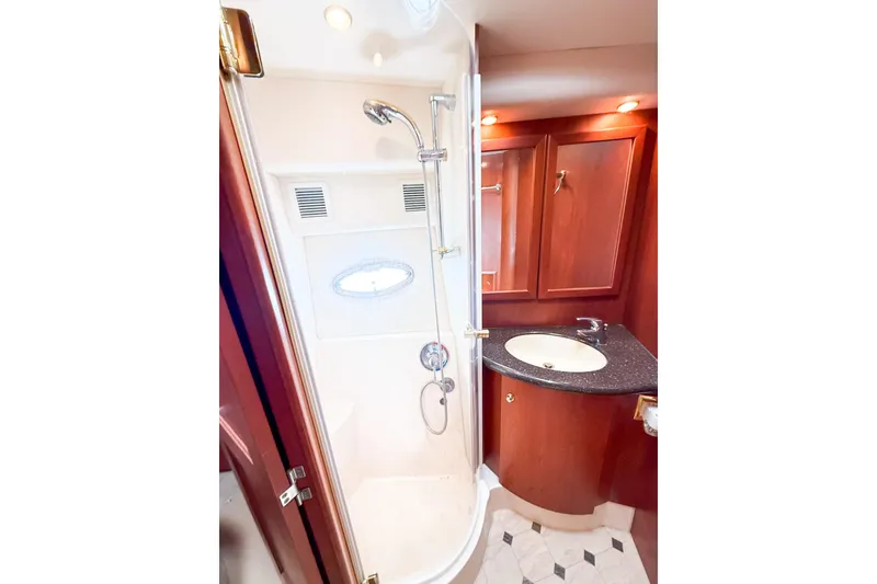 Slide: The Image of Luxurious bathroom in 2004 Silverton 48 Convertible yacht with shower and vanity. - 57
