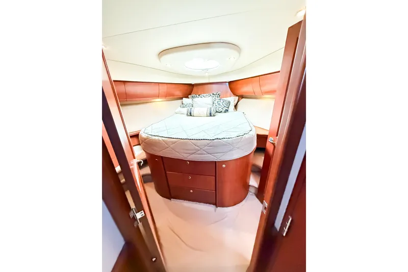 Slide: The Image of Luxurious cabin interior of 2004 Silverton 48 Convertible yacht with elegant wood finish. - 59