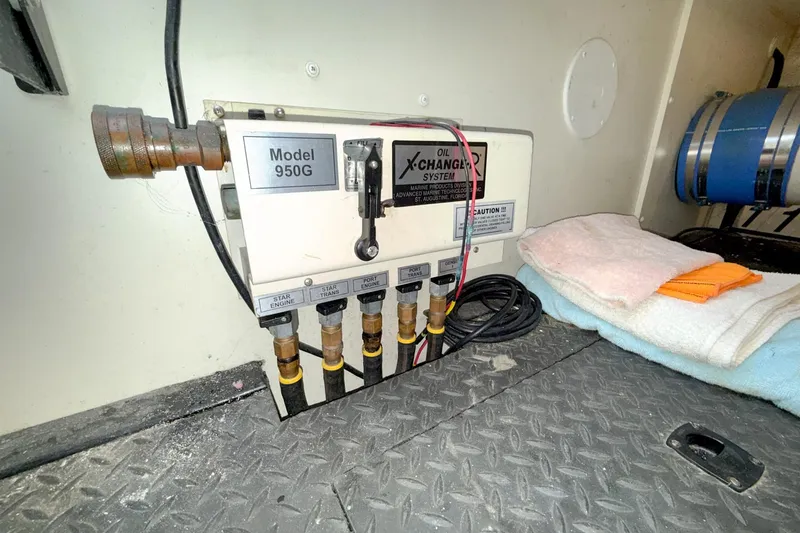 Slide: The Image of Oil X-Change System in 2004 Silverton 48 Convertible engine room, Model 950G. - 78