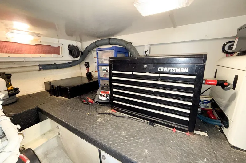 Slide: The Image of Engine room of 2004 Silverton 48 Convertible with Craftsman tool chest and equipment. - 81