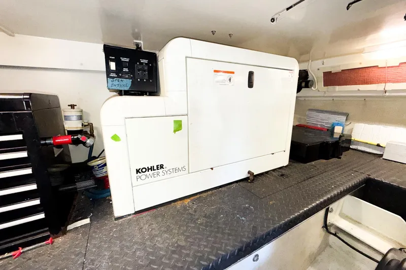 Slide: The Image of Engine room of 2004 Silverton 48 Convertible with Kohler power system generator. - 82