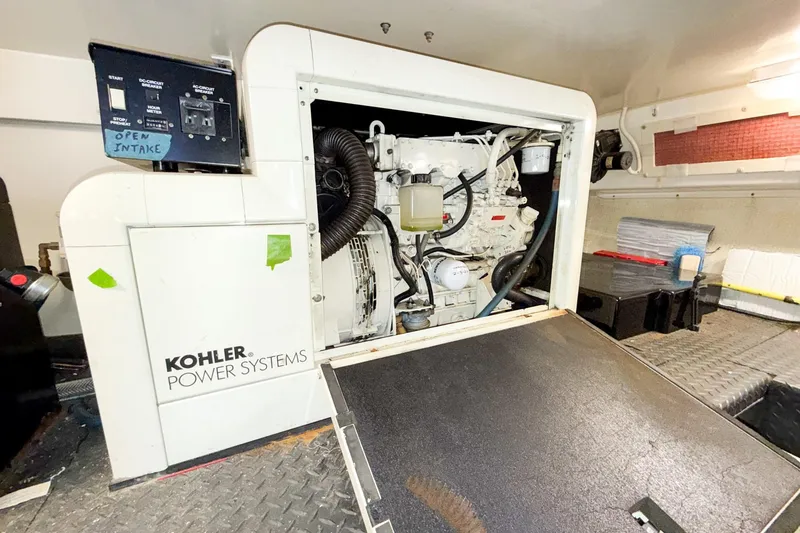 Slide: The Image of Engine room of 2004 Silverton 48 Convertible with Kohler power system. - 83