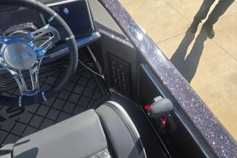 Slide: The Image of 2026 Caymas CX 21 PRO boat interior with steering wheel and control panel. - 11