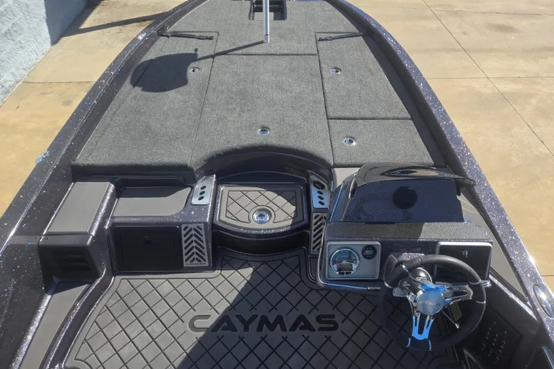 Slide: The Image of 2026 Caymas CX 21 PRO boat interior with steering wheel and dashboard. - 12