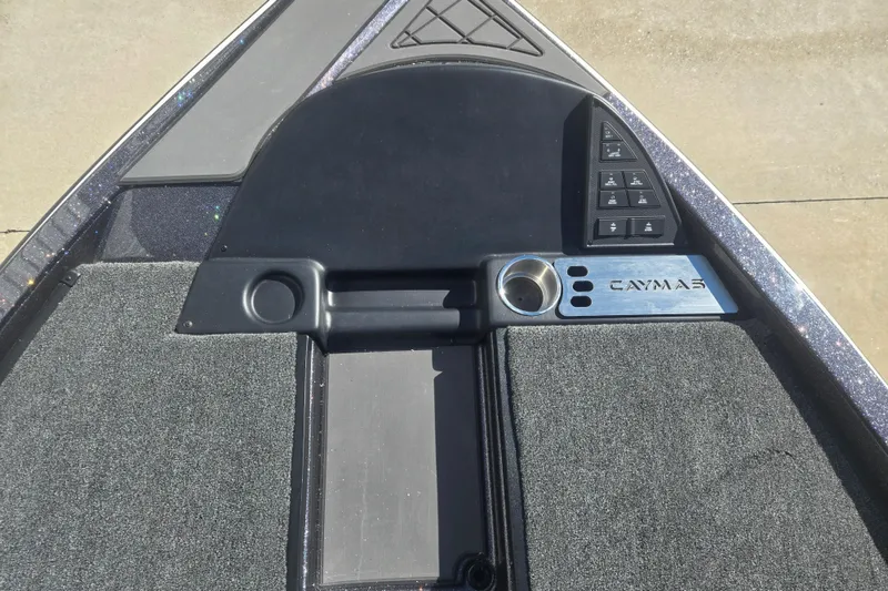 Slide: The Image of 2026 Caymas CX 21 PRO boat dashboard with control panel and cup holder. - 13