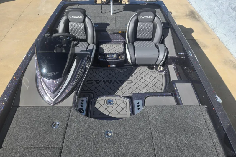 Slide: The Image of 2026 Caymas CX 21 PRO boat interior with dual seats and sleek dashboard design. - 14