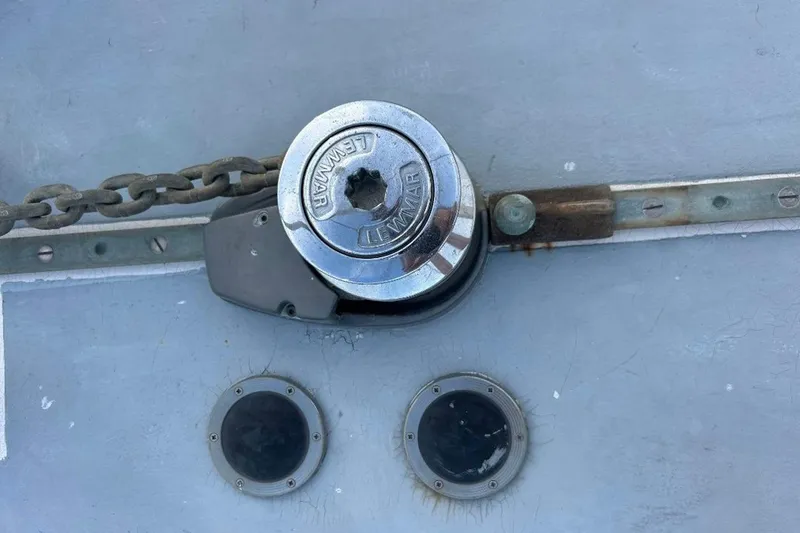 Slide: The Image of Anchor windlass on 1969 Tartan 37 sailboat deck with chain and fittings. - 11