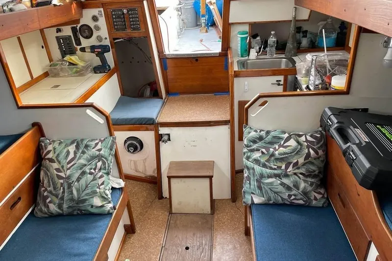 Slide: The Image of Interior of a 1969 Tartan 37 sailboat with cozy seating areas. - 3