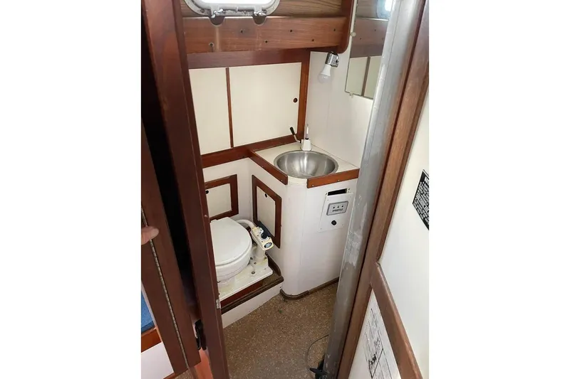 Slide: The Image of Interior of 1969 Tartan 37 sailboat bathroom with sink and toilet. - 7