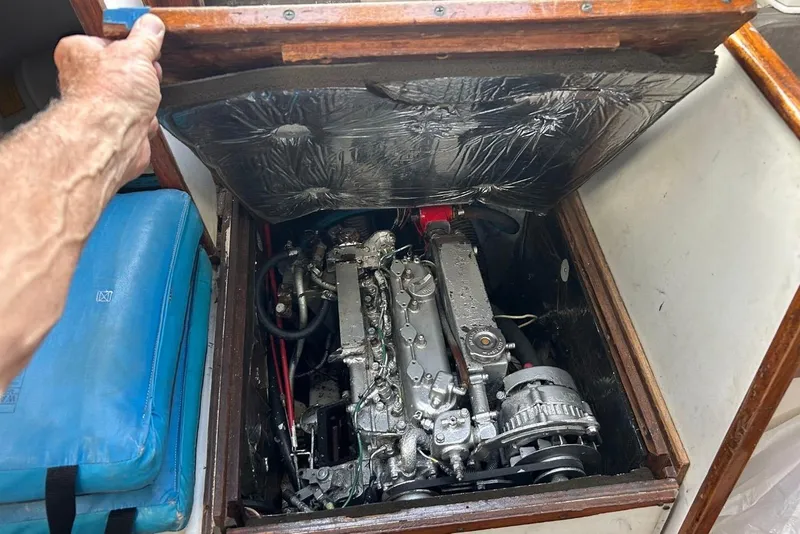 Slide: The Image of Engine compartment of a 1969 Tartan 37 sailboat with visible mechanical components. - 9