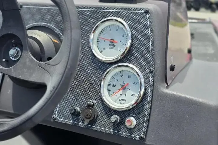 Slide: The Image of Dashboard of 2020 Tracker Pro 160 boat with RPM and MPH gauges. - 13