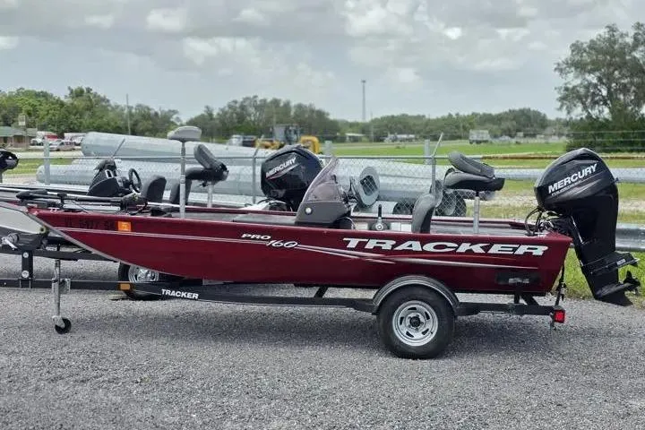 Slide: The Image of 2020 Tracker Pro 160 fishing boat with Mercury outboard motor on a trailer. - 3