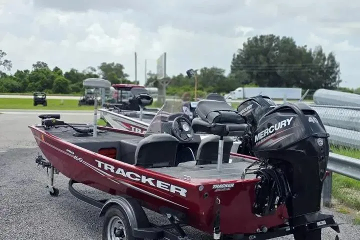 Slide: The Image of 2020 Tracker Pro 160 boat with Mercury engine, parked outdoors on a trailer. - 4