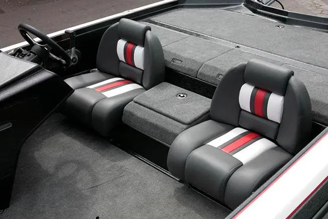 Slide: The Image of 2021 Bullet 21XRD boat on trailer, red and black, parked outdoors. - 4