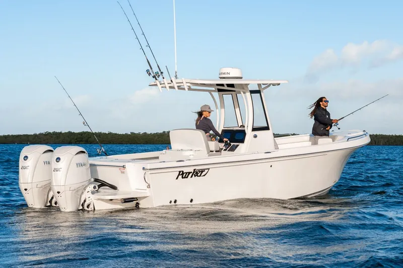 Slide: The Image of Manufacturer Provided Image: 2026 Parker 274 Fathom boat with Yamaha engines, two people fishing on open water. - 2