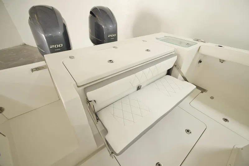 Slide: The Image of 2026 Parker 274 Fathom boat interior with dual Yamaha 200 engines and foldable seating. - 9