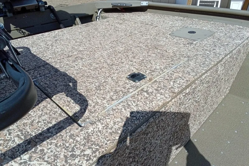 Slide: The Image of 2024 G3 Gator Tough 1652 VBW boat deck with textured surface and mounted equipment. - 10