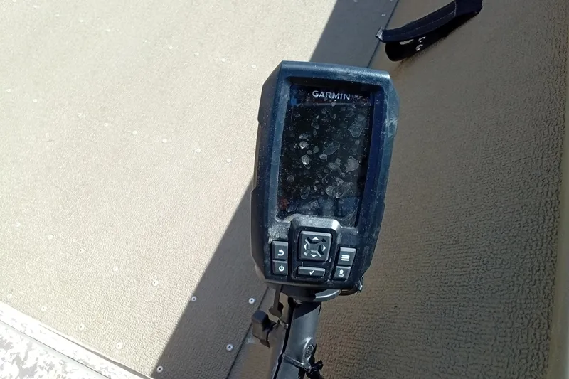 Slide: The Image of Garmin device on 2024 G3 Gator Tough 1652 VBW boat, mounted on textured surface. - 12