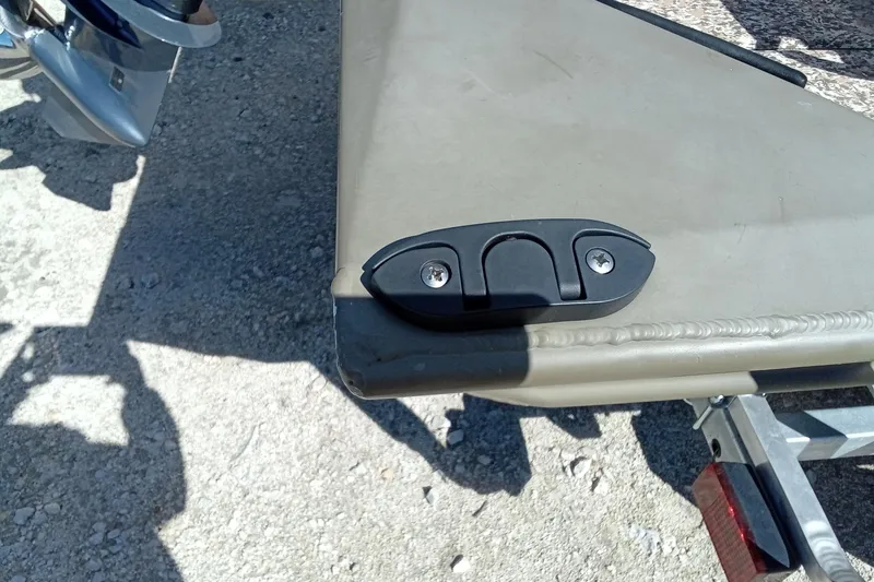 Slide: The Image of 2024 G3 Gator Tough 1652 VBW boat detail with motor and trailer. - 13