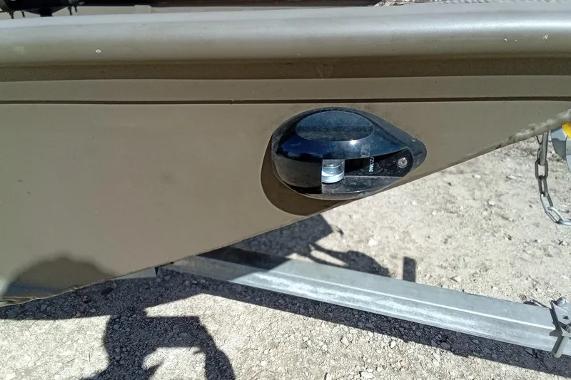 Slide: The Image of 2024 G3 Gator Tough 1652 VBW boat detail, featuring a black cleat on a trailer. - 14