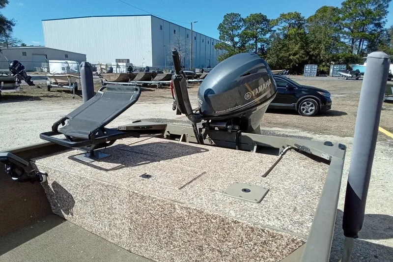 Slide: The Image of 2024 G3 Gator Tough 1652 VBW boat with Yamaha outboard motor in a parking lot. - 19